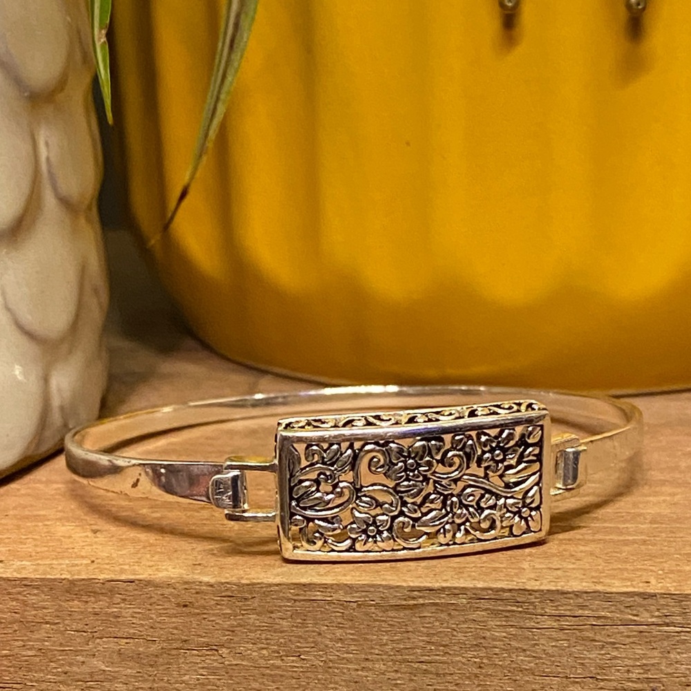 Elegant Sterling Silver Bangle with Intricate Floral Design